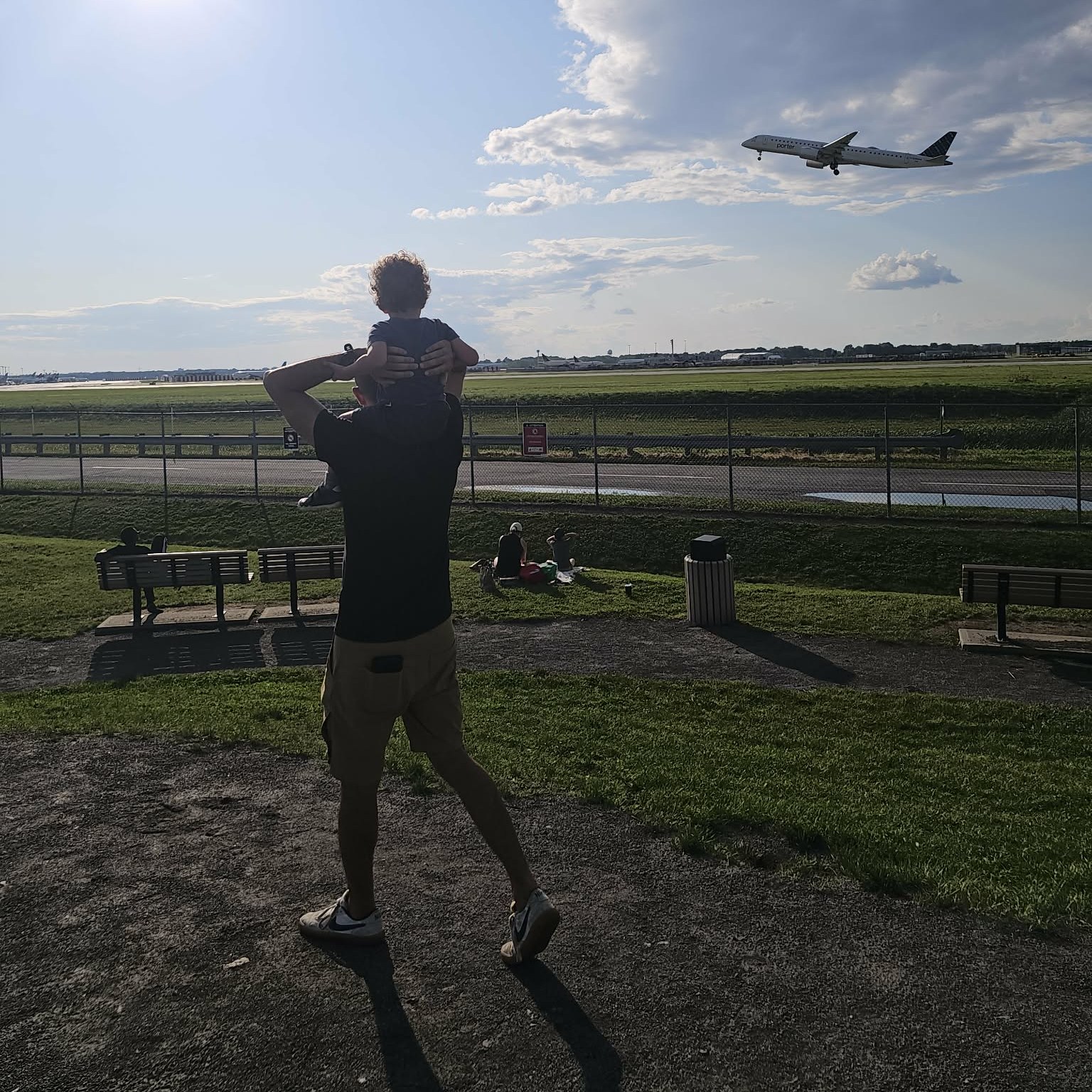 Peter and his toddler watching planes take off